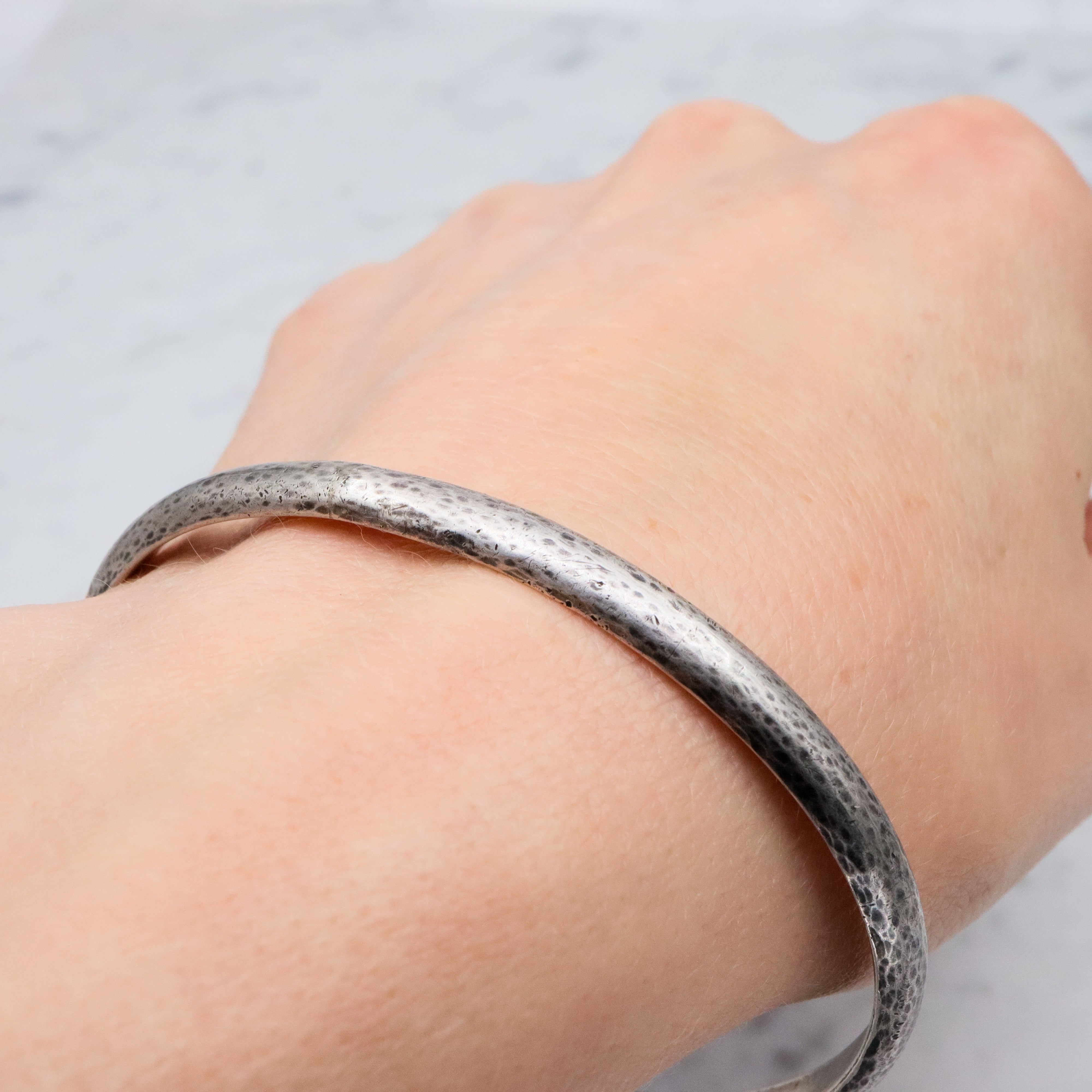 Mid Century hand hammered solid sterling oval bangle